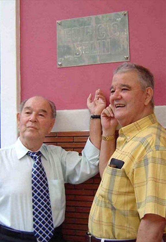 Gabriel Ripoll Sr. (left), the man the factory was named after, with his son and our founder, Gabriel Ripoll Jr. (right), proudly standing in front of it.